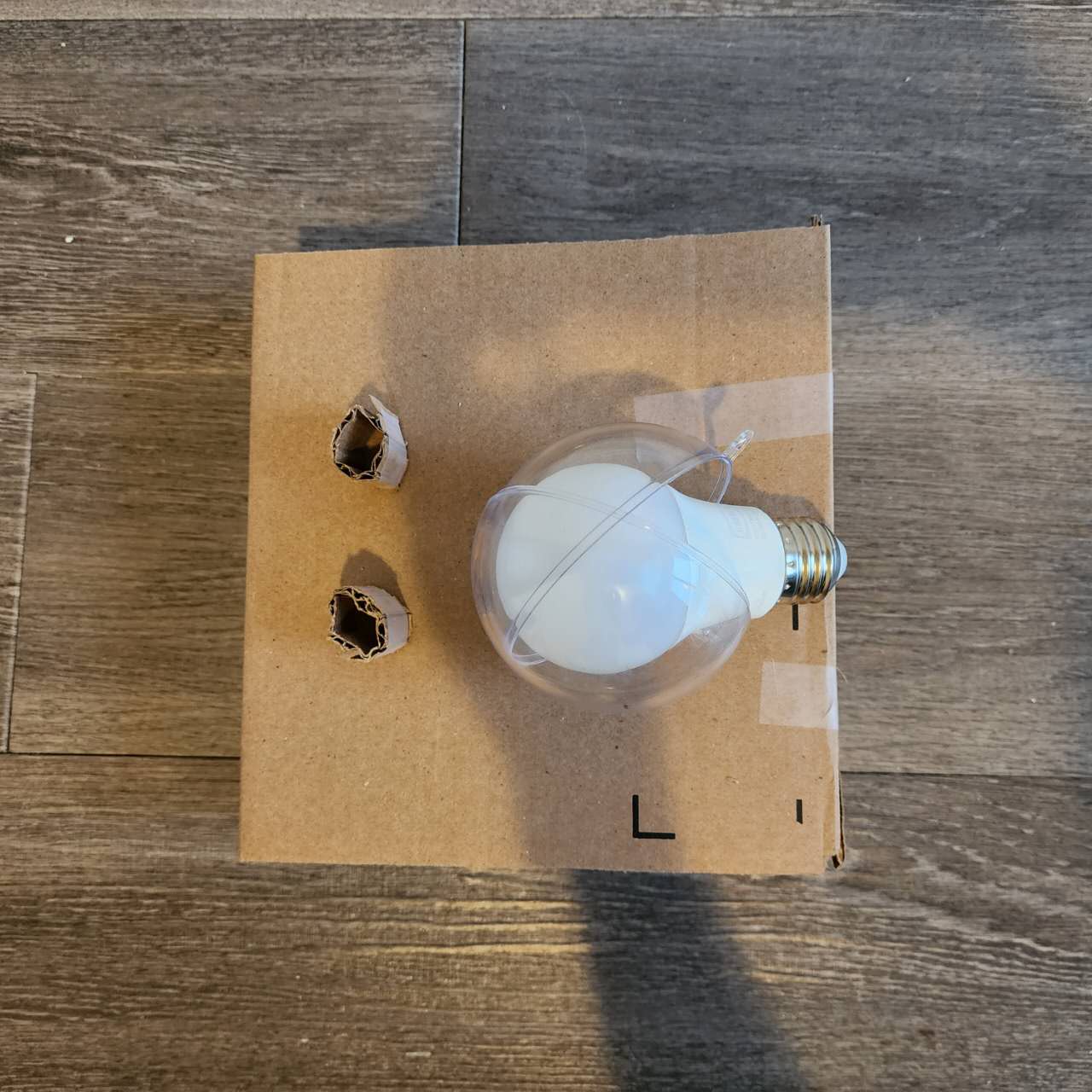 The top view of the first prototype, showing the placement of the two knobs and the ornament.